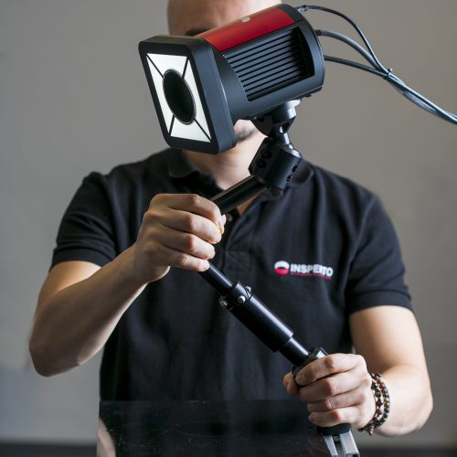 A man holding the S70 inpsekto system